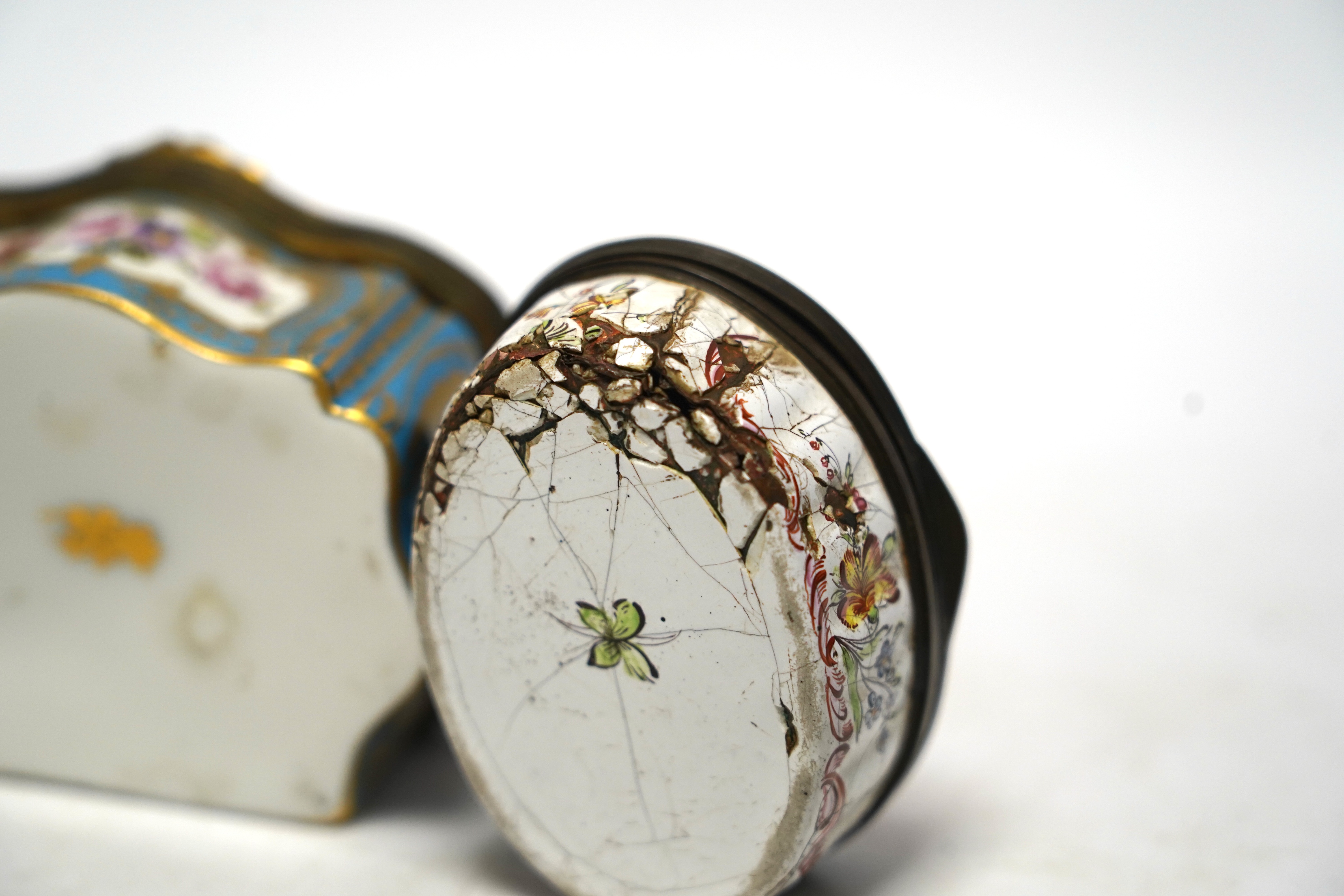 A South Staffordshire enamel bodkin case, 9cm wide, and three other enamel items; a patch box, thread holder and box with hinged cover.